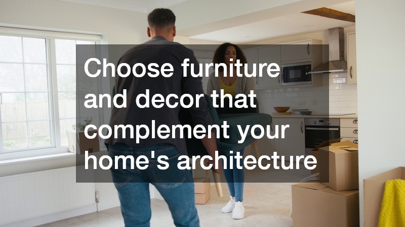 couple carrying a couch into the living room